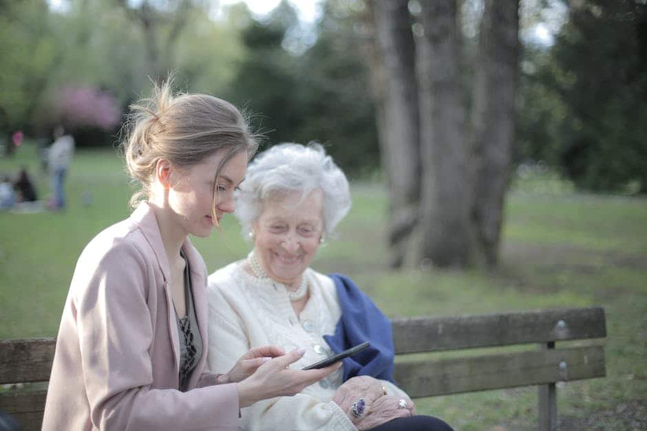 An image of an elderly person smiling and holding hands with a young person, representing the importance of legal protection for seniors.