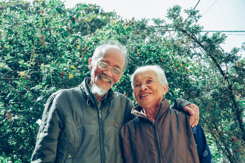An image depicting smiling elderly individuals engaged in social activities, showcasing the importance of community involvement for mental health.