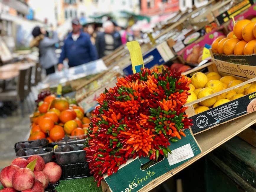 Image of fresh fruits and vegetables in a market stall, showcasing the vibrant colors and variety of local, seasonal produce